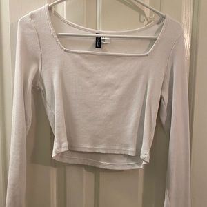 Long sleeve white crop top.